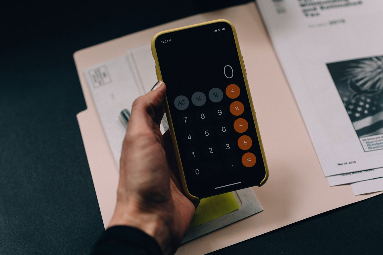 A person holding a calculator